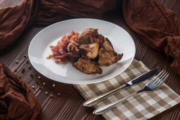 Shish kebab with pickled onions on wooden rustic background