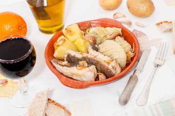 Homemade ray fish with potatos and garlic