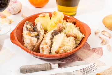 Homemade ray fish with potatos and garlic