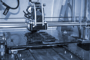 Modern 3D printer printing figure close-up. Automatic three dimensional