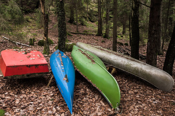 Canoes lying on ground, Sweden