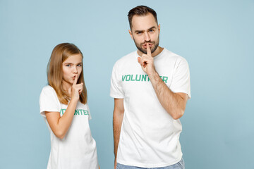 Two young friends couple girl man wears white t-shirt green title volunteer say hush be quiet...