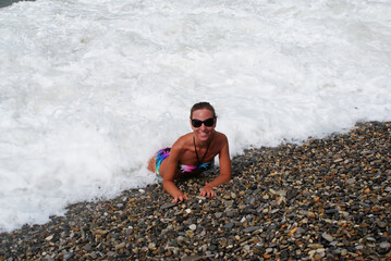 Young fashionable woman resting on the beach of paradise island.