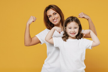 Happy sporty woman in basic white t-shirt have fun with cute child baby girl 5-6 years old. Mom...