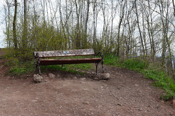 Abandoned wooden bench at the top of tailings heap