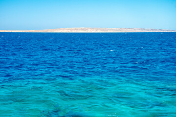 Beautiful seascape of the Egyptian coast, Red Sea, horizon, colorful water, calm.