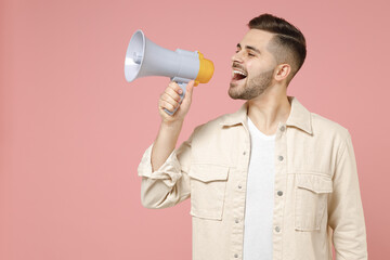 Young fun expressive caucasian man 20s wearing jacket white t-shirt screaming loud shouting hot...