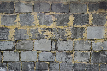 Rough wall of breeze blocks connected with mortar