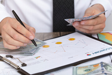 Business accounting concept. Counting Money Pile. economy concept, businessman background.
