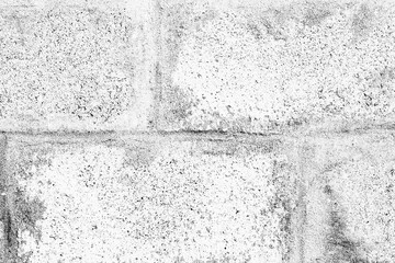 Texture of a brick wall with cracks and scratches which can be used as a background