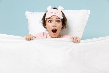 Young shocked confused awaken after nightmare woman in pajamas jam sleep eye mask rest relax at...