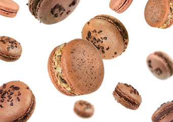 Flying French macarons isolated on white.