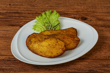 Baked potato with herbs and spices