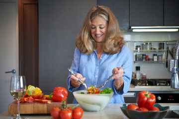 Senior Woman Preparing Salad