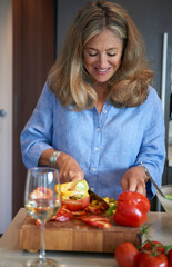 Senior Woman Preparing Salad