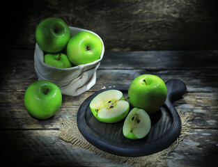 green apples on a wooden table