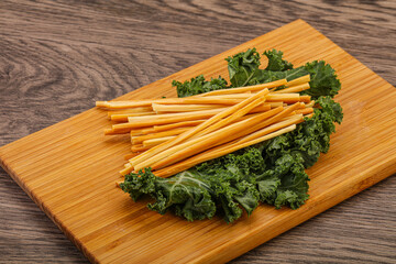 Chechel cheese sticks over board