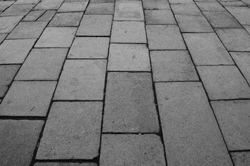 Black and white stone paving, landscape oriented perspective view
