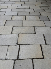Grey stone paving, portrait oriented perspective view