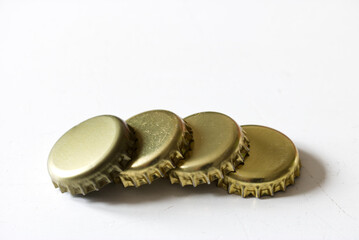some beer bottle caps in a row