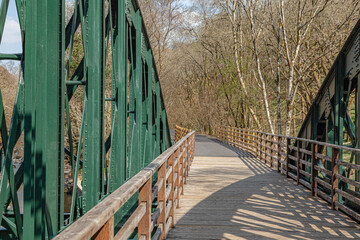 Iron bridge over river in Lake District 