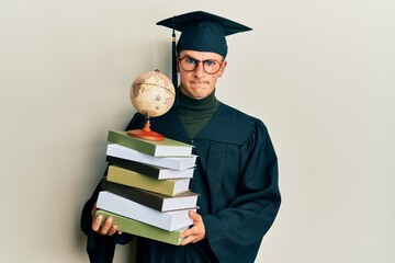 Young caucasian man graduated on geography skeptic and nervous, frowning upset because of problem....