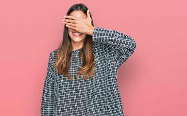 Young beautiful woman wearing casual clothes smiling and laughing with hand on face covering eyes for surprise. blind concept.