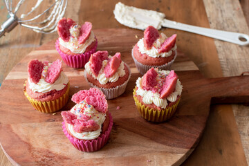 retro style butterfly fairy cakes with pink food colouring 