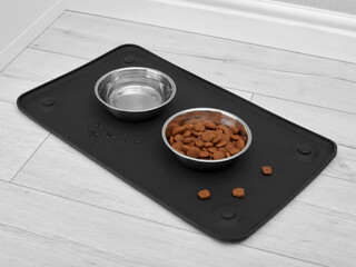 Two bowls with dog food and water