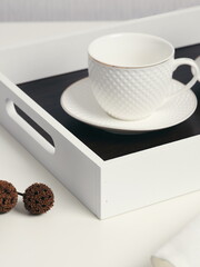 Coffee on breakfast tray.White wooden tray with cups