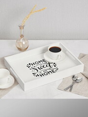 Coffee on breakfast tray.White wooden tray with cups