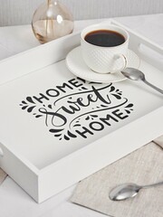 Coffee on breakfast tray.White wooden tray with cups
