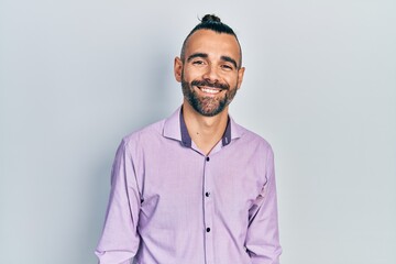 Obraz premium Young hispanic man wearing casual clothes with a happy and cool smile on face. lucky person.