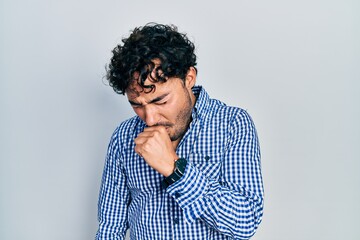 Fototapeta na wymiar Young hispanic man wearing casual clothes feeling unwell and coughing as symptom for cold or bronchitis. health care concept.