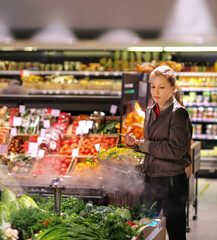 Woman buying fruits and vegetables  at the market