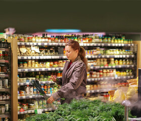 Woman buying fruits and vegetables  at the market