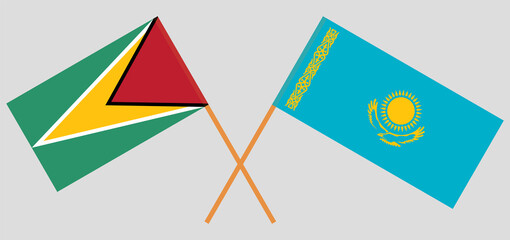 Crossed flags of Guyana and Kazakhstan. Official colors. Correct proportion