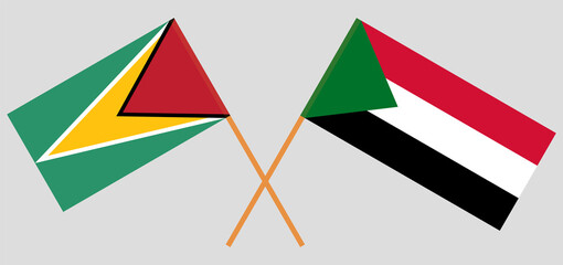 Crossed flags of Guyana and the Sudan. Official colors. Correct proportion