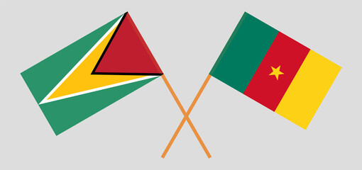 Crossed flags of Guyana and Cameroon. Official colors. Correct proportion