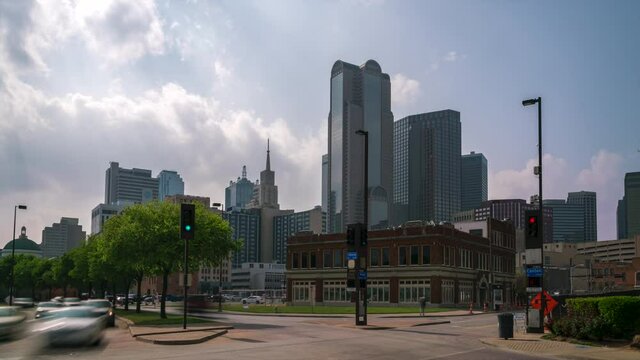 Time Lapse of City Street Corner with Tall Building in the Background