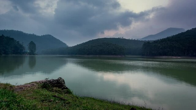 Time Lapse of Clouds over a Lake With Reflection on water at Echo Point, Near the City of Munnar, Kerala, India