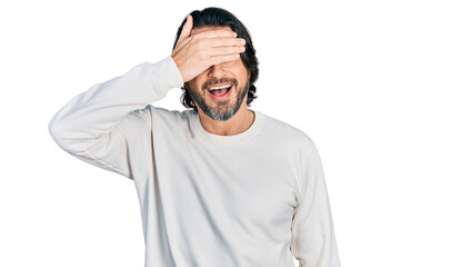 Fototapeta premium Middle age caucasian man wearing casual clothes smiling and laughing with hand on face covering eyes for surprise. blind concept.