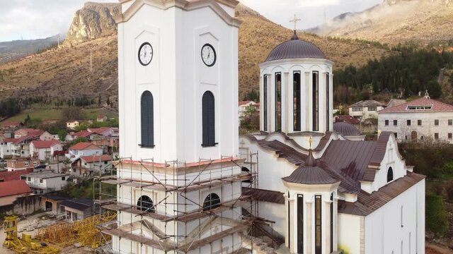 Aerial drone view of Orthodox church. Old church and bell tower during the restoration. Mostar, Bosnia and Herzegovina.