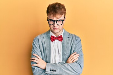 Young caucasian nerd man wearing glasses wearing hipster elegant look with bowtie skeptic and...