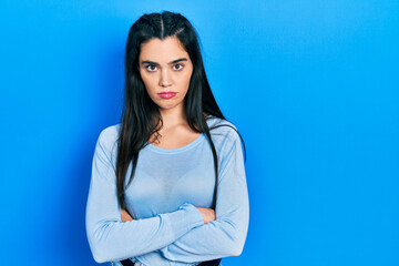 Obraz premium Young hispanic girl wearing casual clothes skeptic and nervous, disapproving expression on face with crossed arms. negative person.