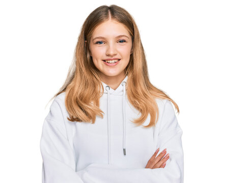 Beautiful young caucasian girl wearing casual sweatshirt happy face smiling with crossed arms looking at the camera. positive person.