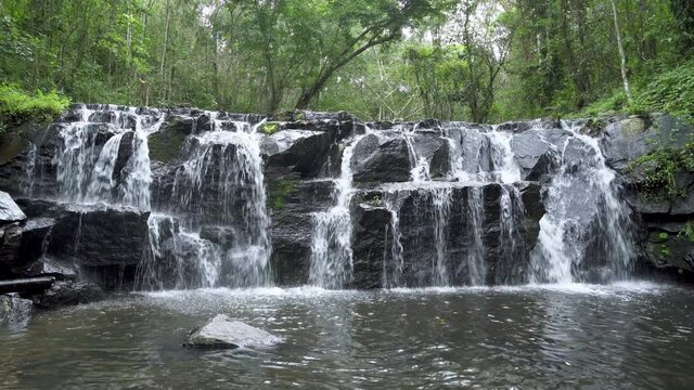 Beautiful waterfall cliff in tropical forest at Namtok Samlan National Park, Saraburi, Thailand