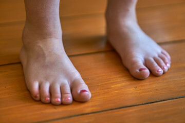 Little baby feet with painted nails. Pedicure for children. Little girl's toes. High quality photo