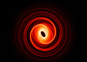 Wonderful and abstract round and parabolic patterns draw different light paths with LED ball lights on a dark background, pendulum.
