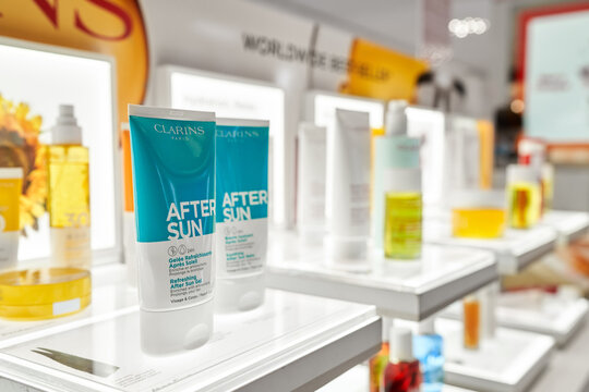 Clarins beauty products set on shelf of Rinascente in Milan, refreshing after sun gel. Clarins is French luxury skin care, cosmetics and perfume company. Milan, Italy - December 15, 2020